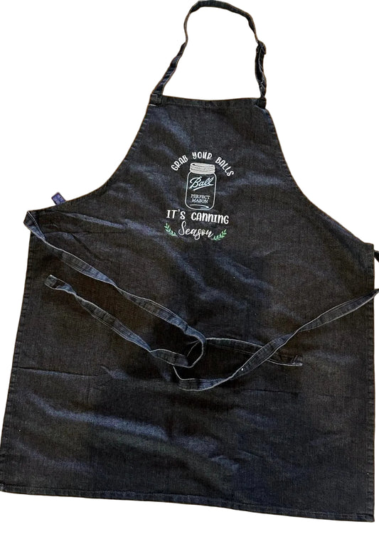 Black apron with white text on a White background